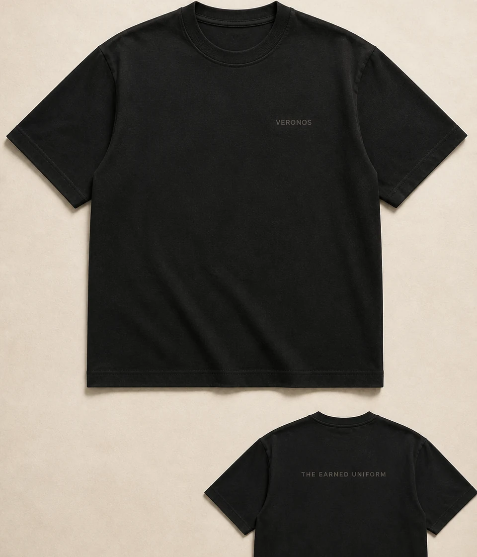 Concept visualization of the Earned Uniform tee in a quiet studio flat lay